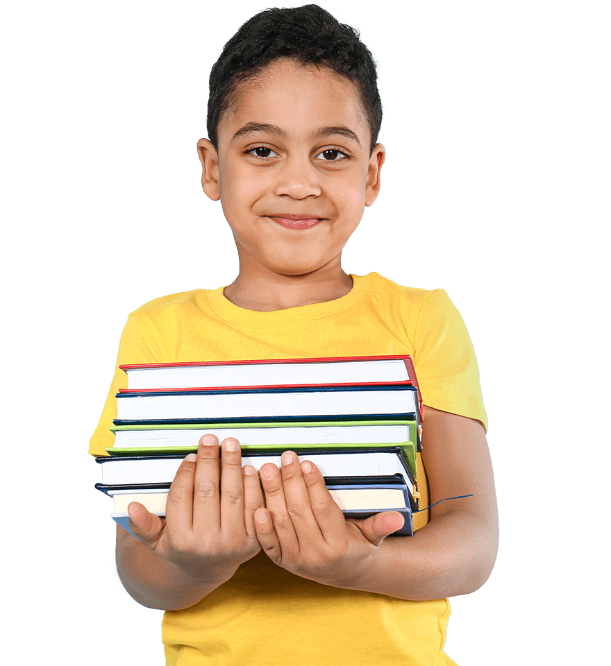 A young boy in a yellow shirt smiling at the camera, holding a stack of colorful books about education planning against a green background.