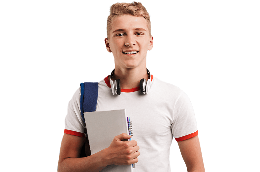 A cheerful young male student with headphones around his neck, holding notebooks and a pen, wearing a white t-shirt and a blue backpack
