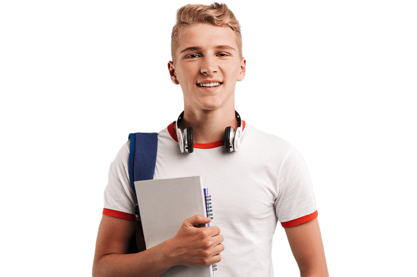 A cheerful young male student with headphones around his neck, holding notebooks and a pen, wearing a white t-shirt and a blue backpack