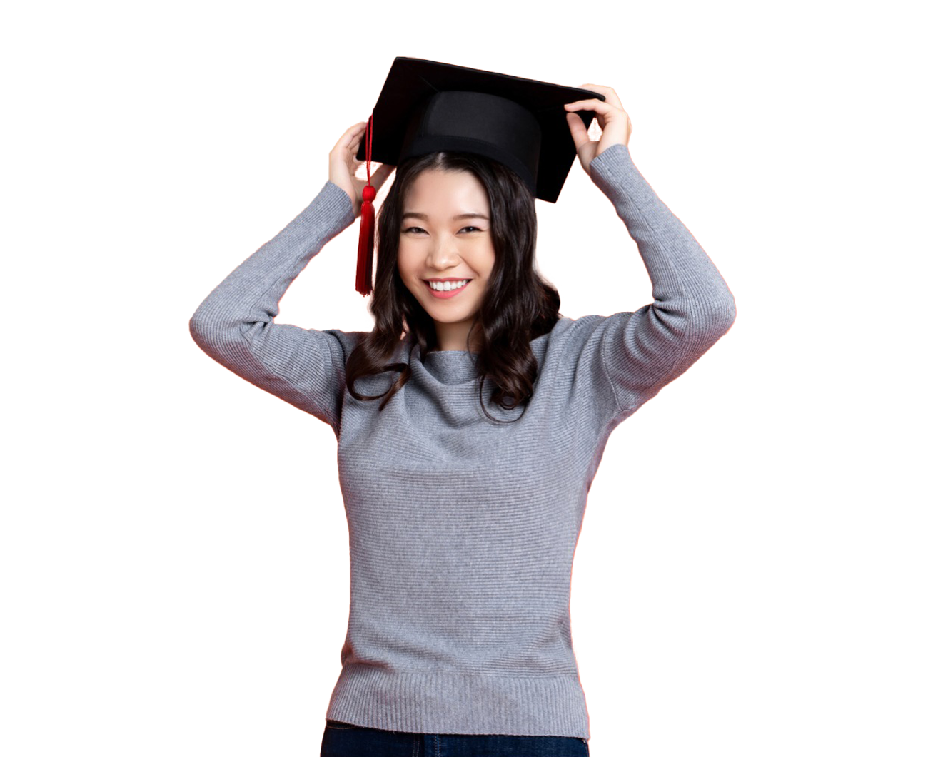 Woman smiling while wearing a graduation cap
