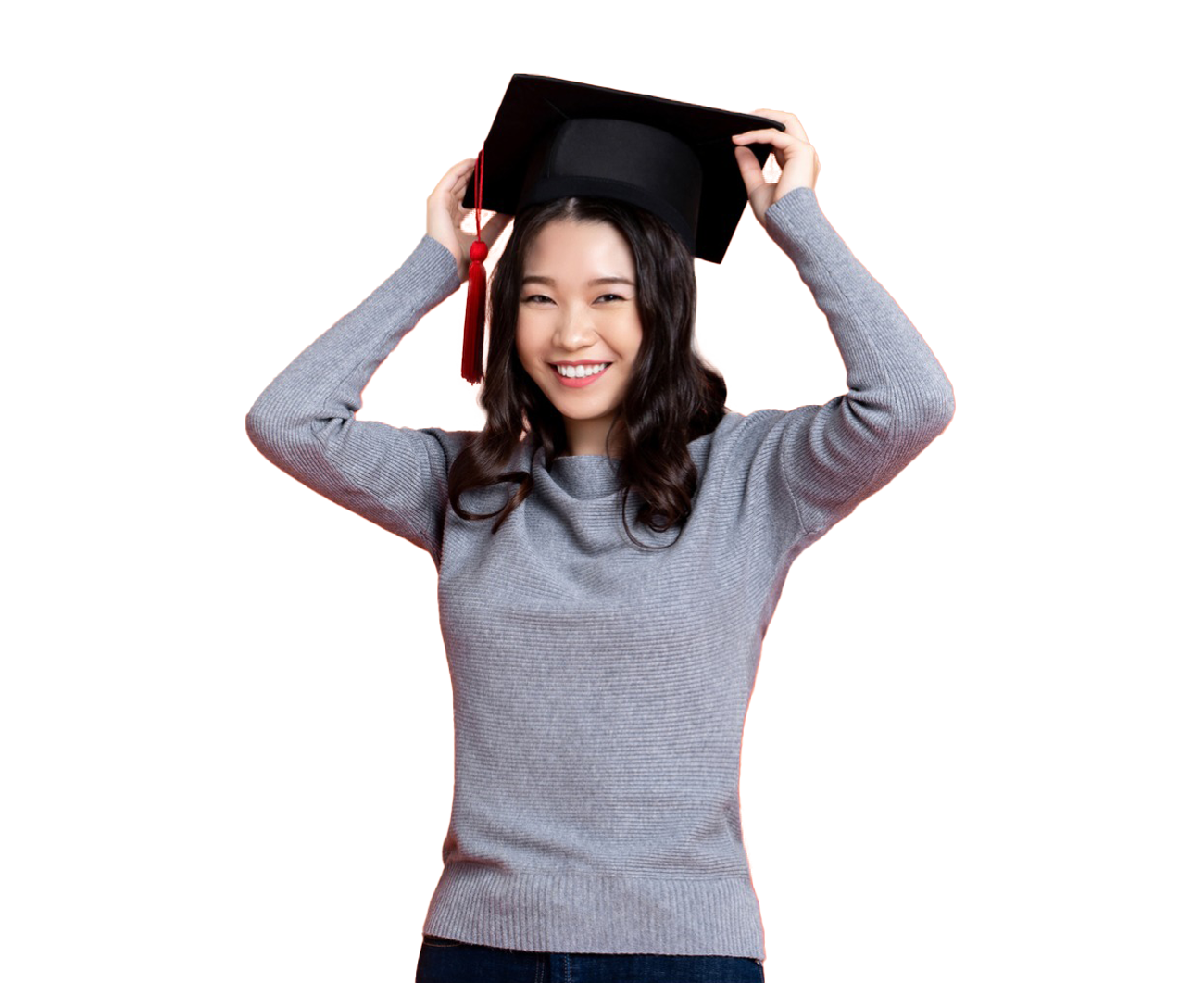 Woman smiling while wearing a graduation cap