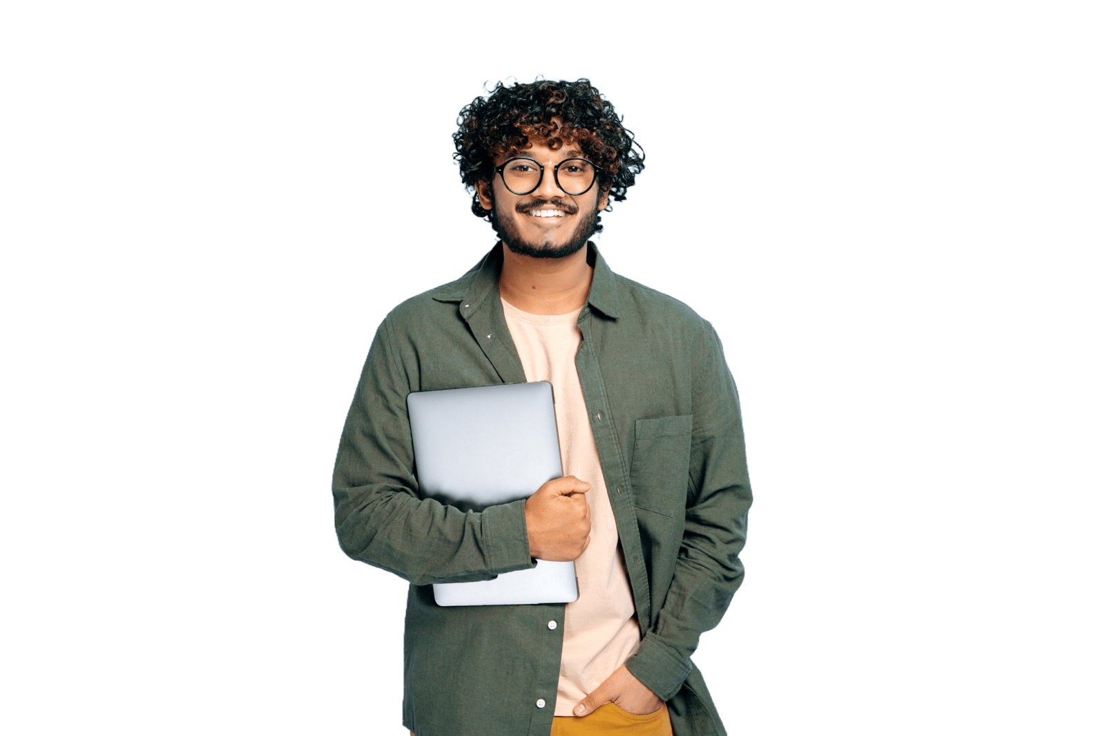 Young adult man smiling while holding a laptop