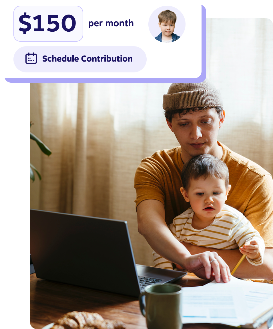 A father and son sit in front a laptop and enjoying quality time together.