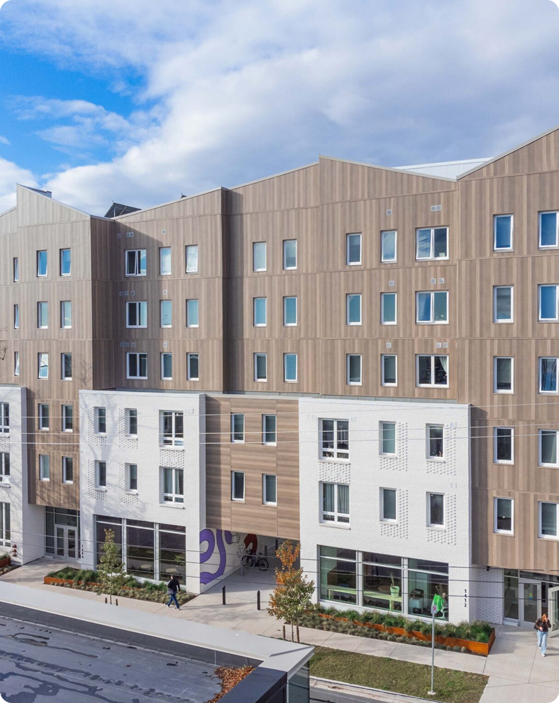 A building's exterior featuring multiple windows, showcasing a modern architectural design and inviting atmosphere.